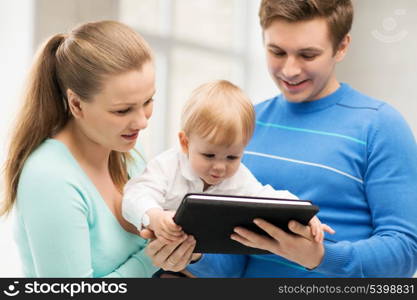 happy parents and adorable baby with tablet pc