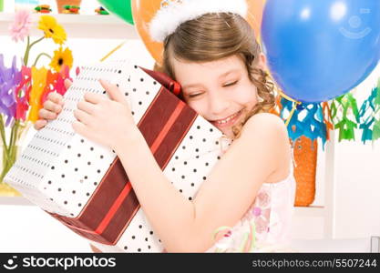 happy party girl with balloons and gift box