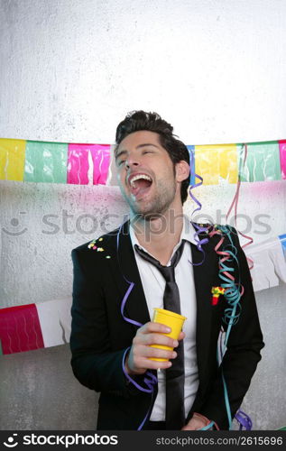 Happy party young man drinking enjoying alone dancing