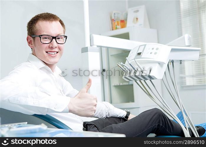 Happy patient at dentist office