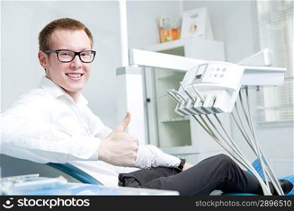 Happy patient at dentist office
