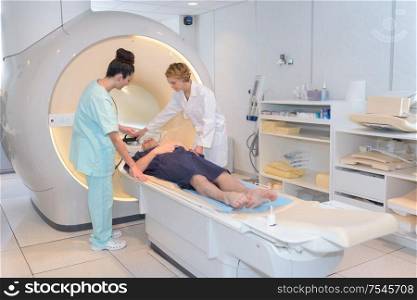happy patient undergoing mri scan at hospital