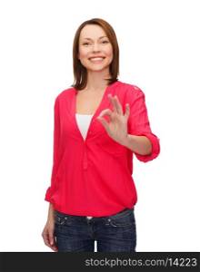 happy people concept - smiling woman in casual clothes showing ok gesture