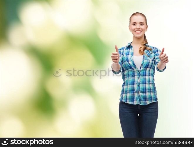 happy people concept - young woman in casual clothes showing thumbs up