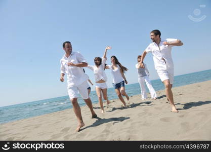 happy people group have fun run and jump on beach beautiful sand beach