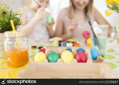happy people painting eggs