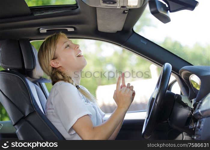 happy pleasant woman in a car