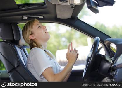 happy pleasant woman in a car