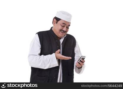 Happy politician gesturing while reading text message