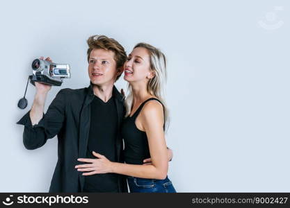 Happy portrait of Couple holding Video camera and Record clip video
