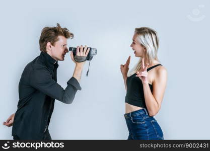 Happy portrait of Couple holding Video camera and Record clip video