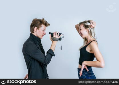 Happy portrait of Couple holding Video camera and Record clip video