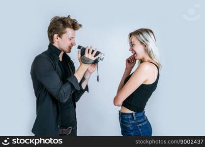 Happy portrait of Couple holding Video camera and Record clip video