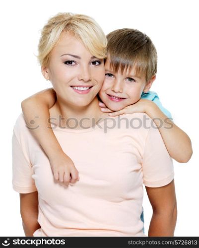 Happy portrait of the mother and son of six years. Isolated on white