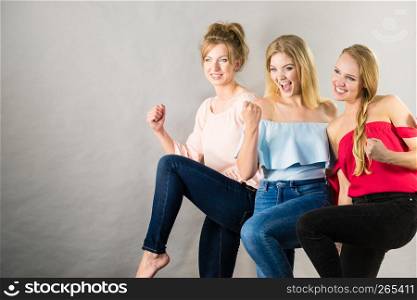 Happy positive female friends having fun enjoying their feminine leisure time. Friendship concept.. Positive female friends having fun