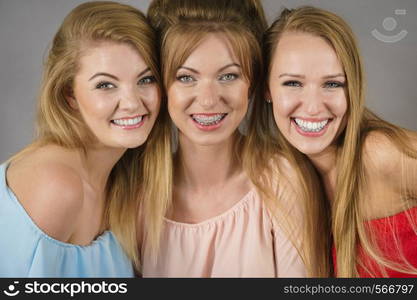 Happy positive female friends having fun enjoying their feminine leisure time. Friendship concept.. Positive female friends having fun