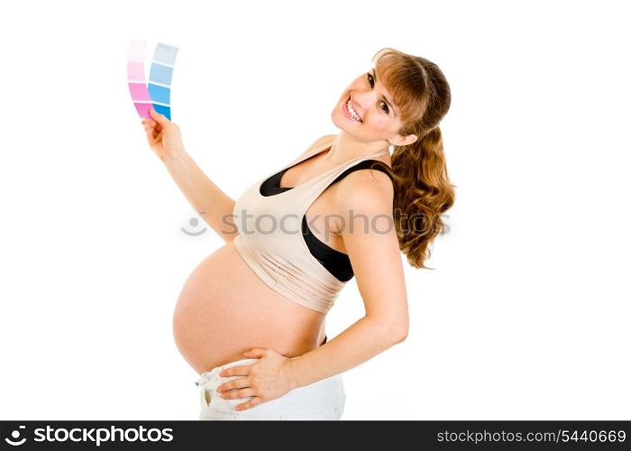 Happy pregnant woman holding color paint samples isolated on white&#xA;