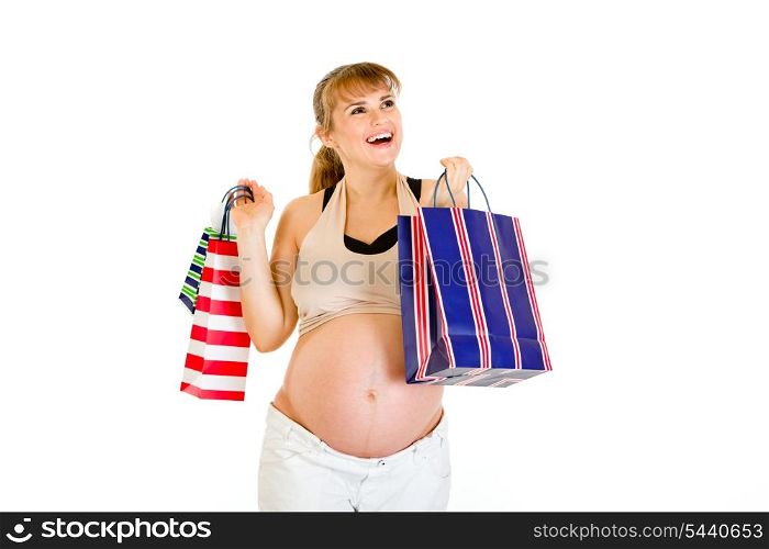 Happy pregnant woman holding shopping bags in hands isolated on white&#xA;
