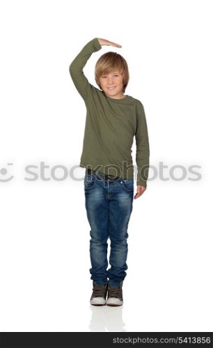 Happy preteen boy pointing measuring what has grown isolated on white background