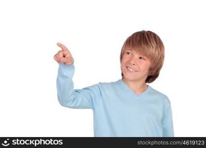 Happy preteen boy pointing something isolated on a over white background