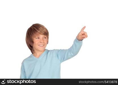 Happy preteen boy pointing something isolated on a over white background