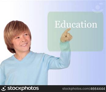Happy preteen boy pointing the word Education isolated on a over white backgroun
