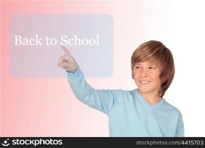 Happy preteen boy pointing the words Back to School isolated on a over white backgroun