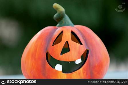 Happy pumpkin outside with a funny smile