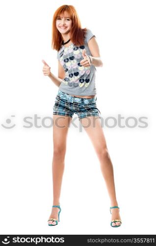 Happy red-haired girl in a t-shirt and shorts