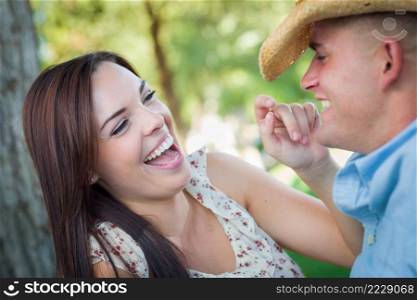 Happy Romantic Caucasian Couple Talking in the Park.