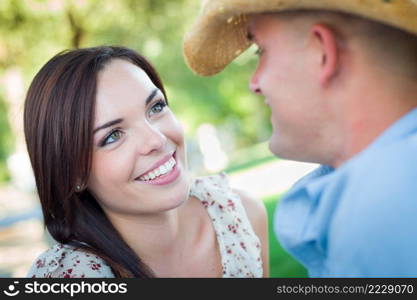 Happy Romantic Caucasian Couple Talking in the Park.
