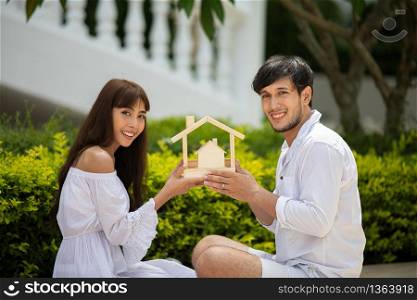 Happy Romantic Couples lover talking and drinking wine while having a picnic