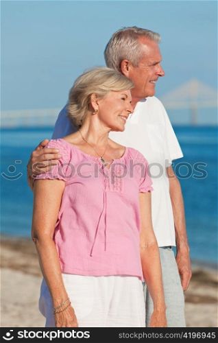 Happy Romantic Senior Couple Embracing on Beach