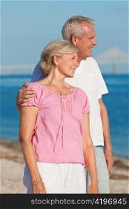Happy Romantic Senior Couple Embracing on Beach
