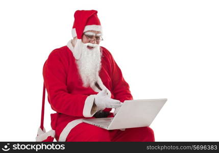 Happy Santa Claus using laptop over white background