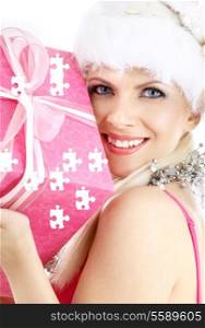 happy santa helper girl with pink puzzle gift box