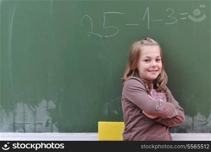 happy school girl on math classes finding solution and solving problems