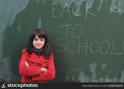 happy school girl on math classes finding solution and solving problems