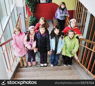 happy school girls running outdoor at sunny autumn day