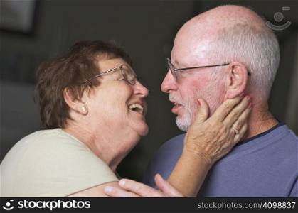 Happy Senior Adult Couple Facing Each Other