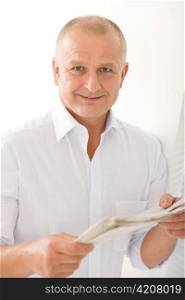 Happy senior businessman professional portrait read newspapers white shirt