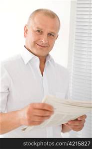 Happy senior businessman professional portrait read newspapers white shirt