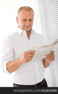 Happy senior businessman professional portrait read newspapers white shirt