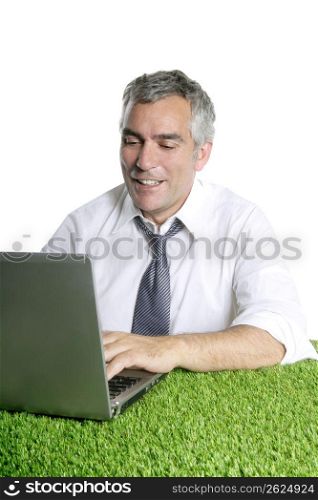 happy senior businessman working green grass desk computer typing