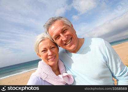 Happy senior couple at the beach