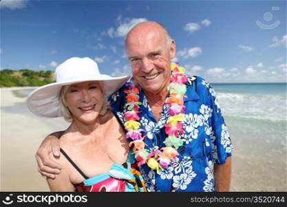 Happy senior couple at tropical beach
