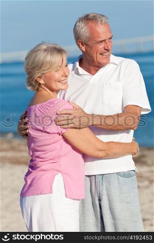 Happy Senior Couple Embracing on Beach