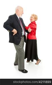 Happy senior couple having a great time square dancing. Isolated on white.