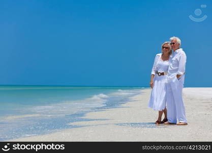 Happy Senior Couple Looking To Sea on A Tropical Beach