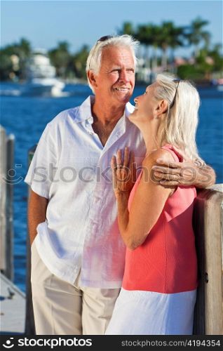 Happy Senior Couple On Vacation By Tropical Sea